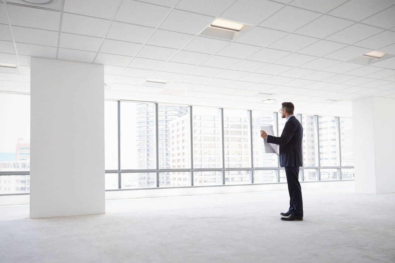 Male assessing an empty property