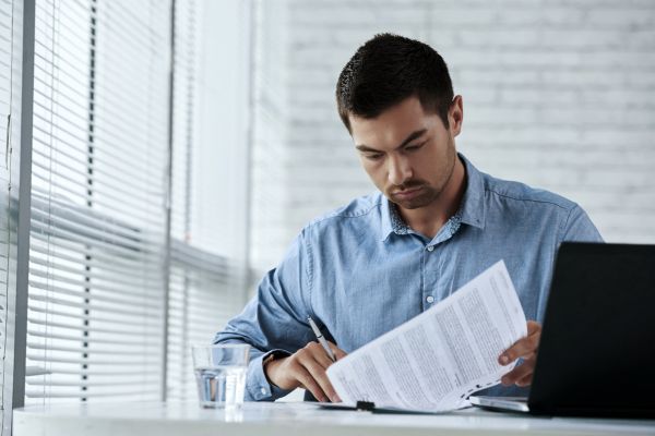 Accountant reading through paperwork